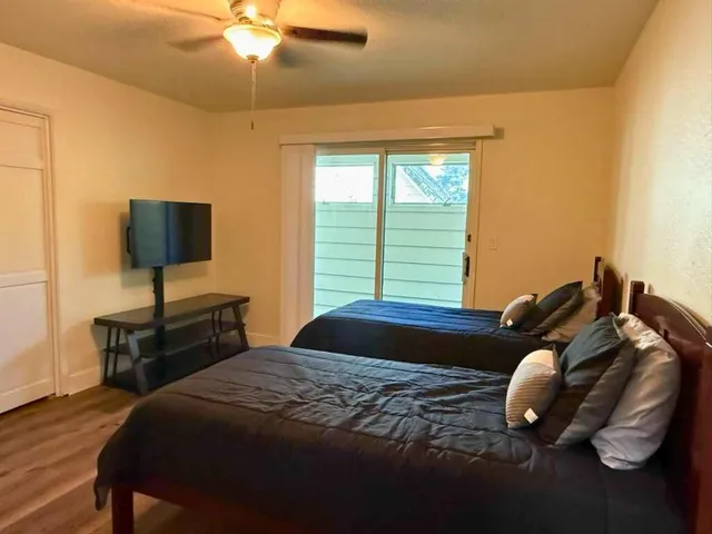 a bedroom with a bed and window