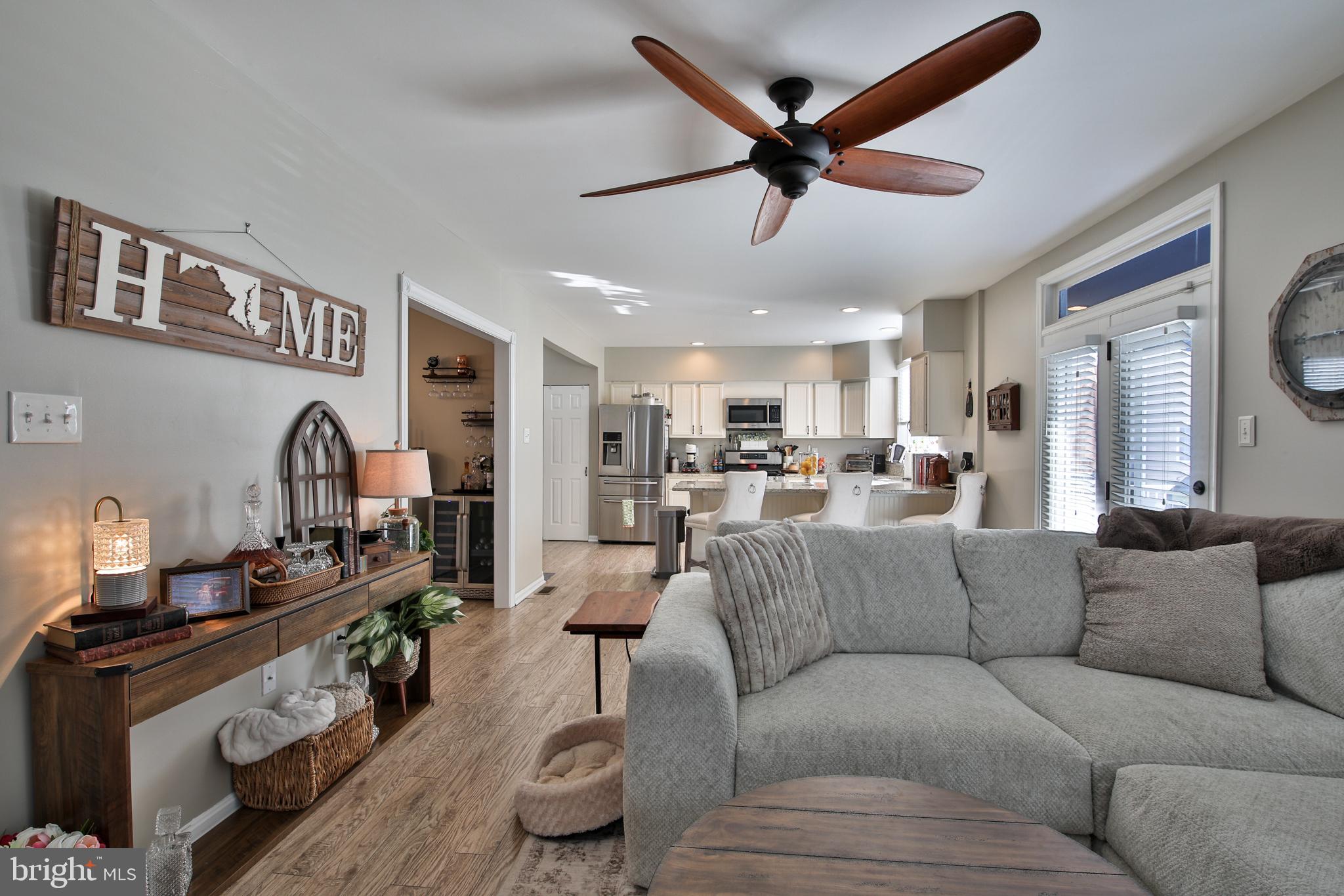 201 Mariners Point Drive Middle River, MD 21220 - Photo 13 of 53 a living room with furniture and kitchen view