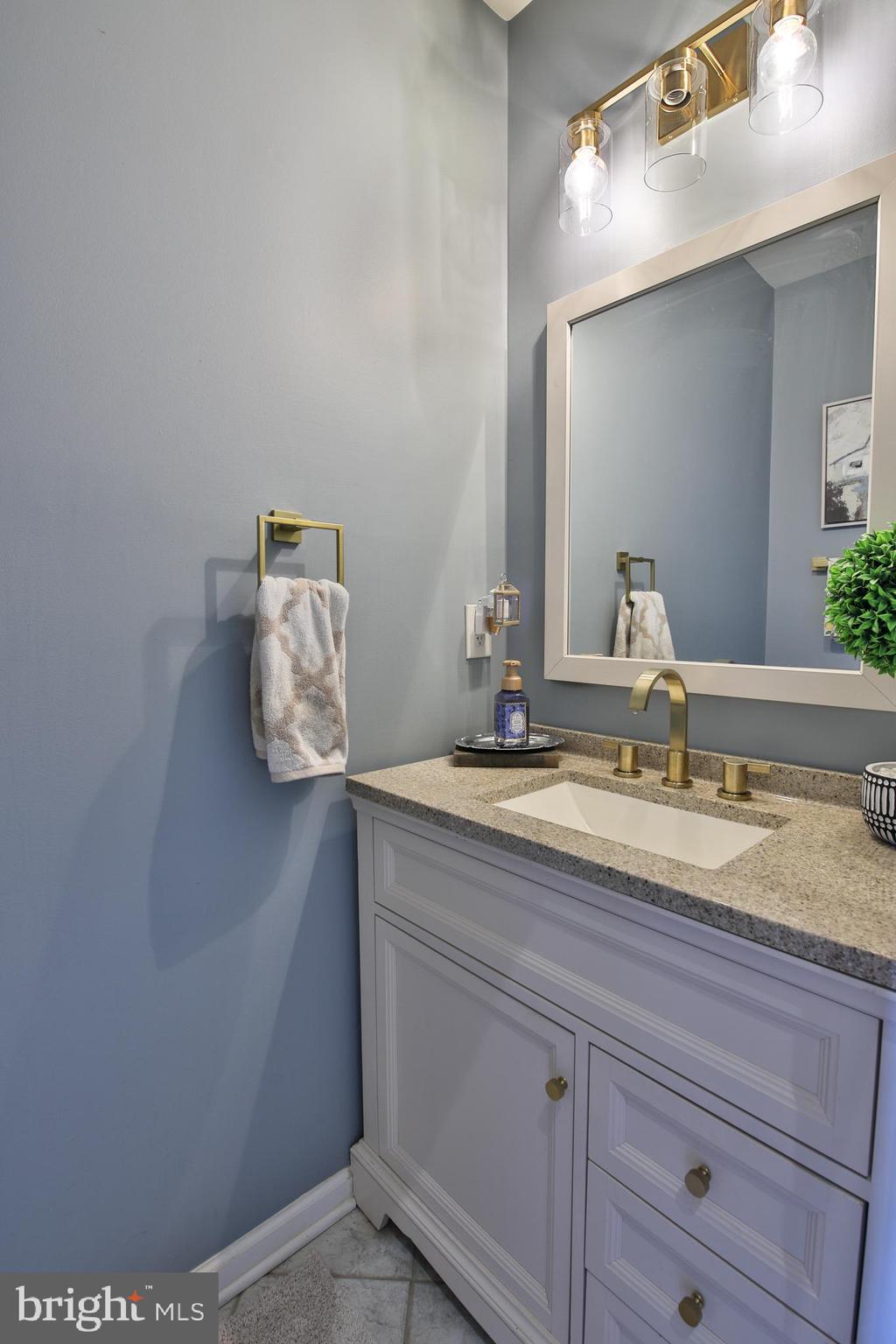 201 Mariners Point Drive Middle River, MD 21220 - Photo 26 of 53 a bathroom with a granite countertop sink and a mirror