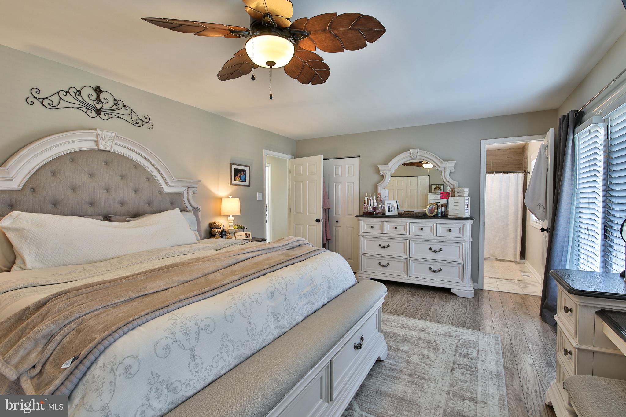 201 Mariners Point Drive Middle River, MD 21220 - Photo 28 of 52 a bedroom with a bed and a chandelier