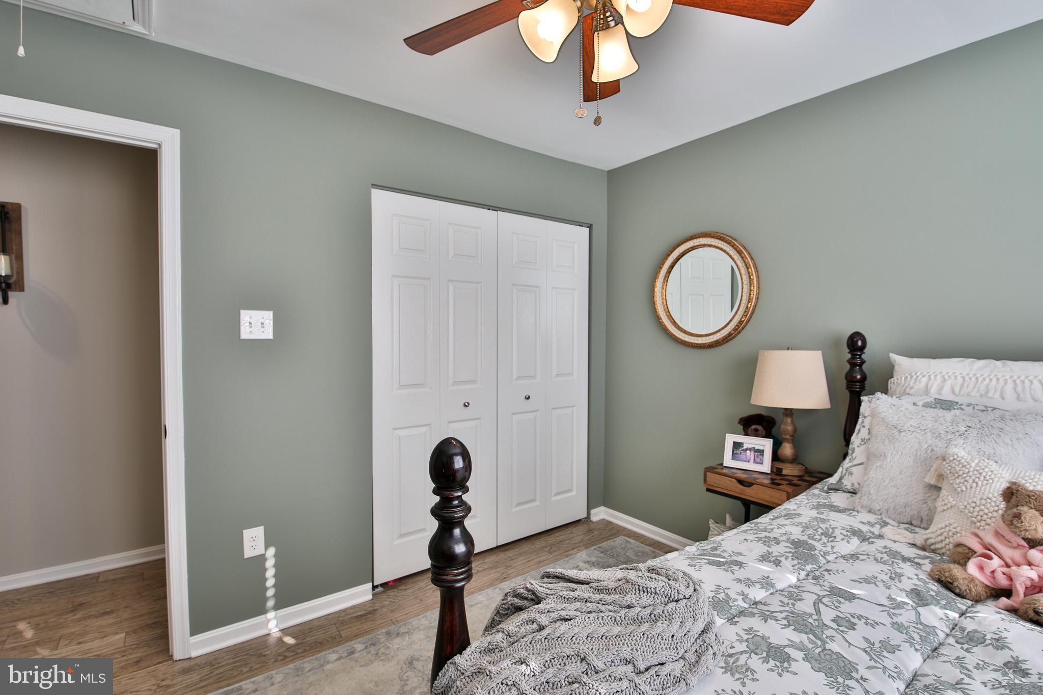 201 Mariners Point Drive Middle River, MD 21220 - Photo 36 of 53 a bedroom with a bed and a chandelier