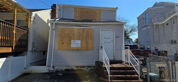 a view of front door and small buildings