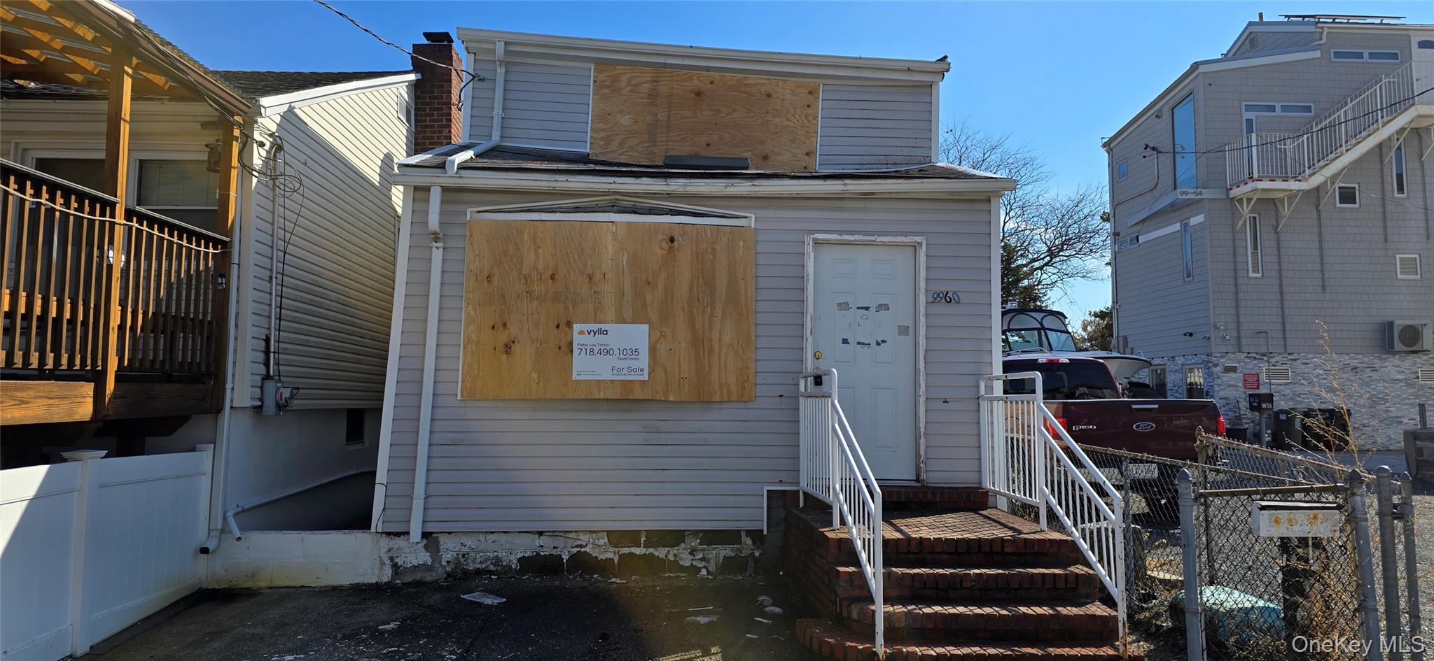 a view of front door and small buildings