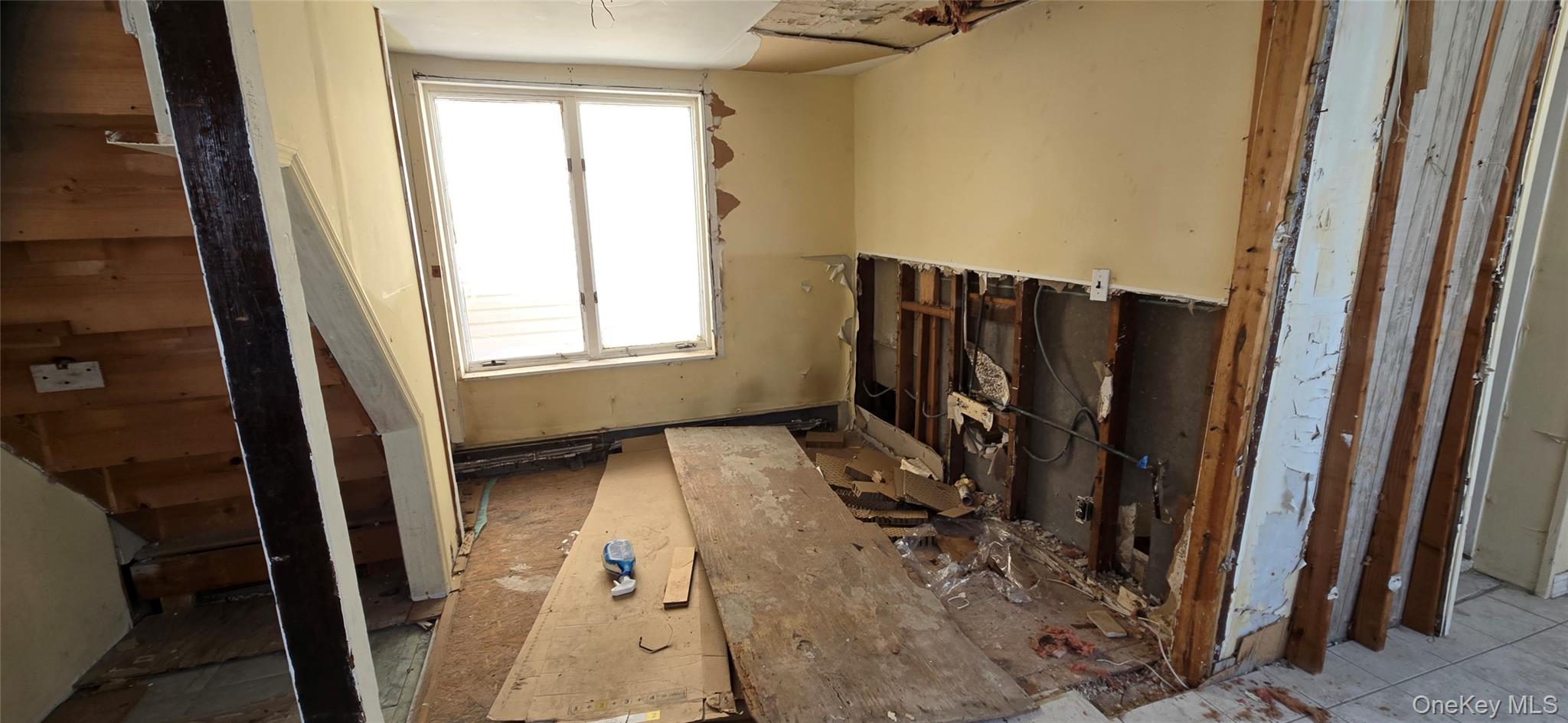 99-60 164th Road Queens, NY 11414 - Photo 12 of 21 a view of a closet with wooden floor and a window