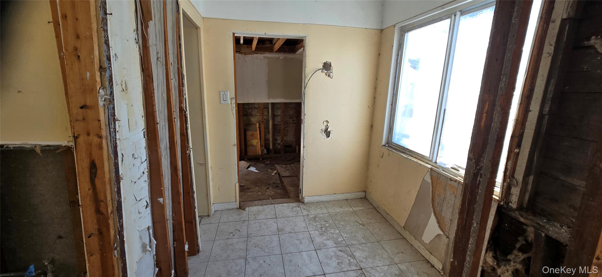 99-60 164th Road Queens, NY 11414 - Photo 13 of 21 a view of a hallway with wooden floor and closet area