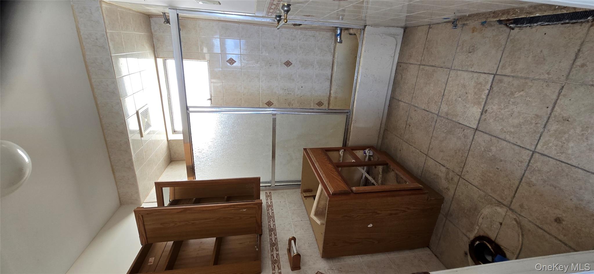 99-60 164th Road Queens, NY 11414 - Photo 14 of 21 a bathroom with a sink a toilet and mirror