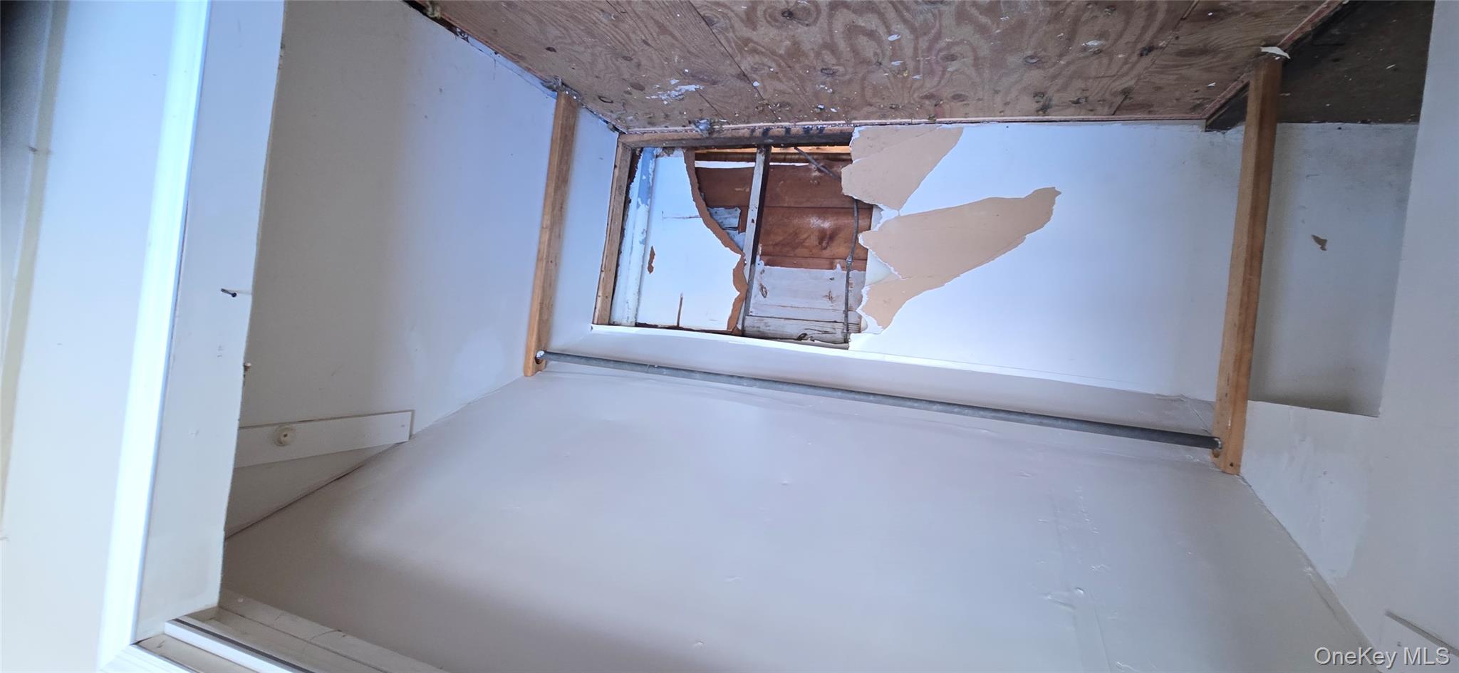 99-60 164th Road Queens, NY 11414 - Photo 19 of 21 a view of an empty room with stairs