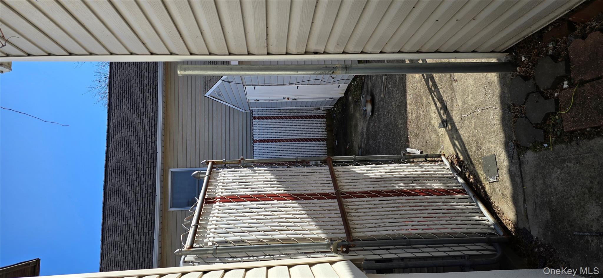 99-60 164th Road Queens, NY 11414 - Photo 4 of 21 a view of a house with a door