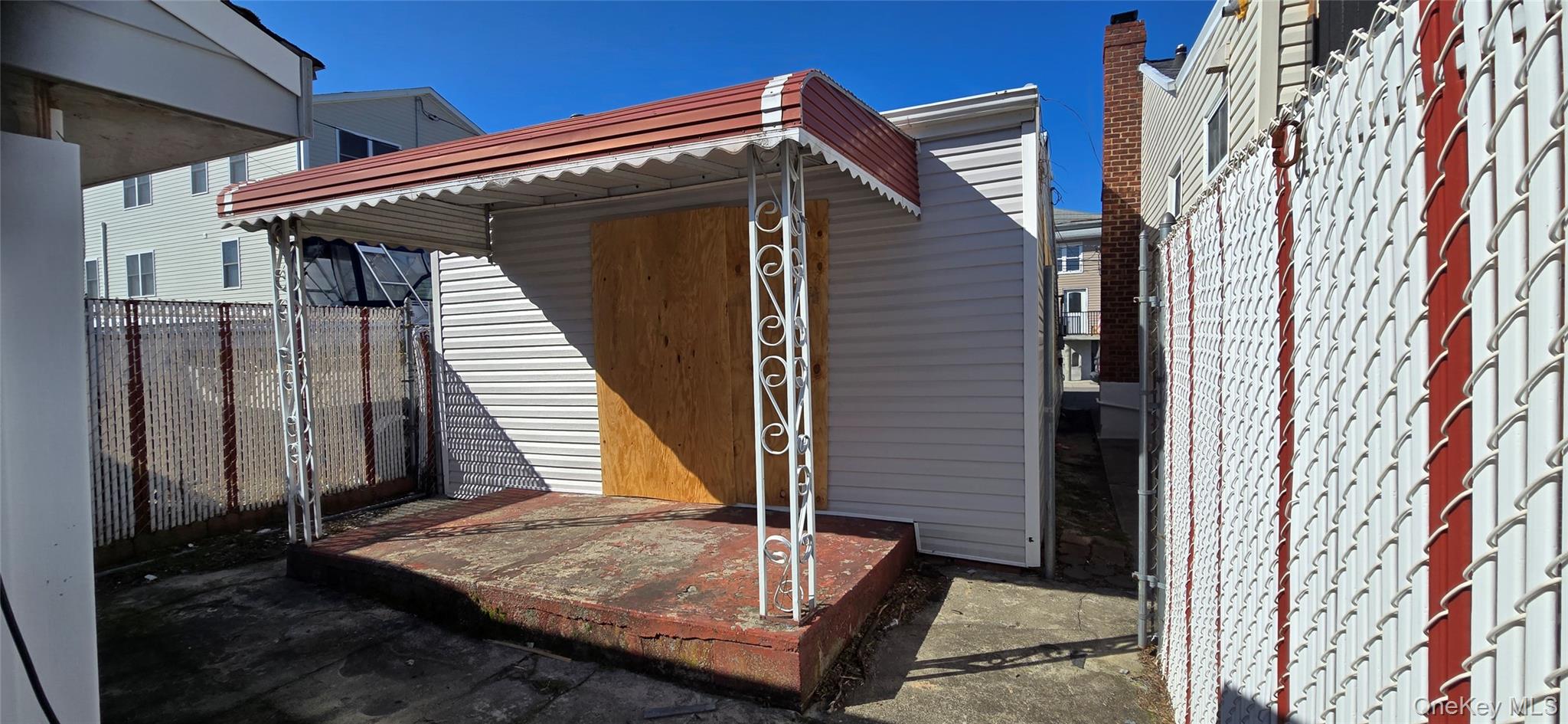 99-60 164th Road Queens, NY 11414 - Photo 5 of 21 a view of a house with a door