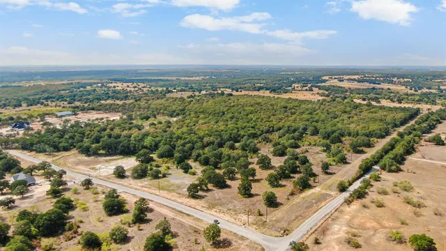 a view of outdoor space with trees all around