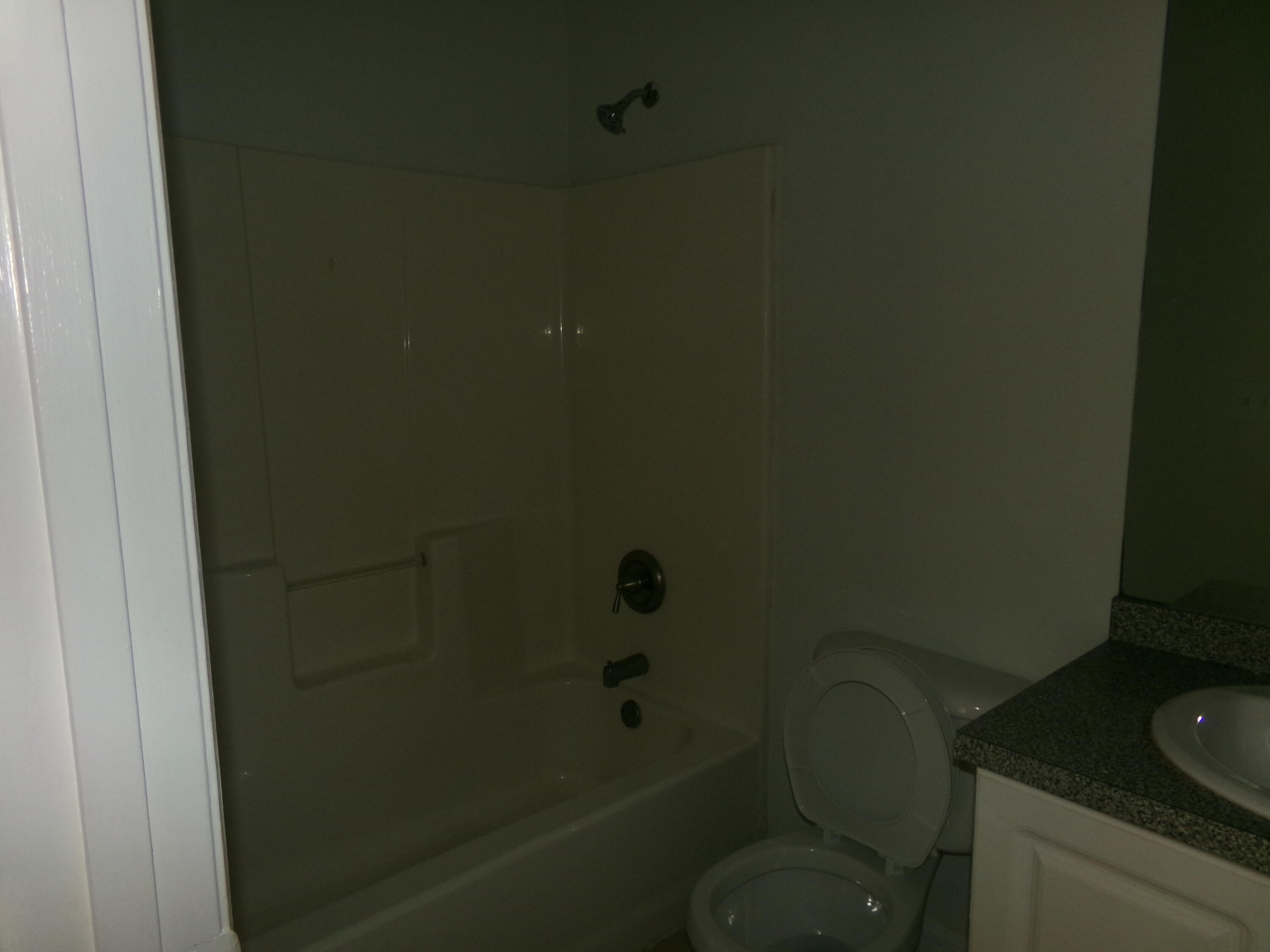 319 15th Street Southwest Vero Beach, FL 32962 - Photo 7 of 9 a bathroom with a toilet and sink
