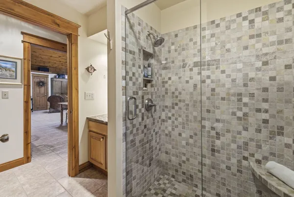 a bathroom with a shower and a sink