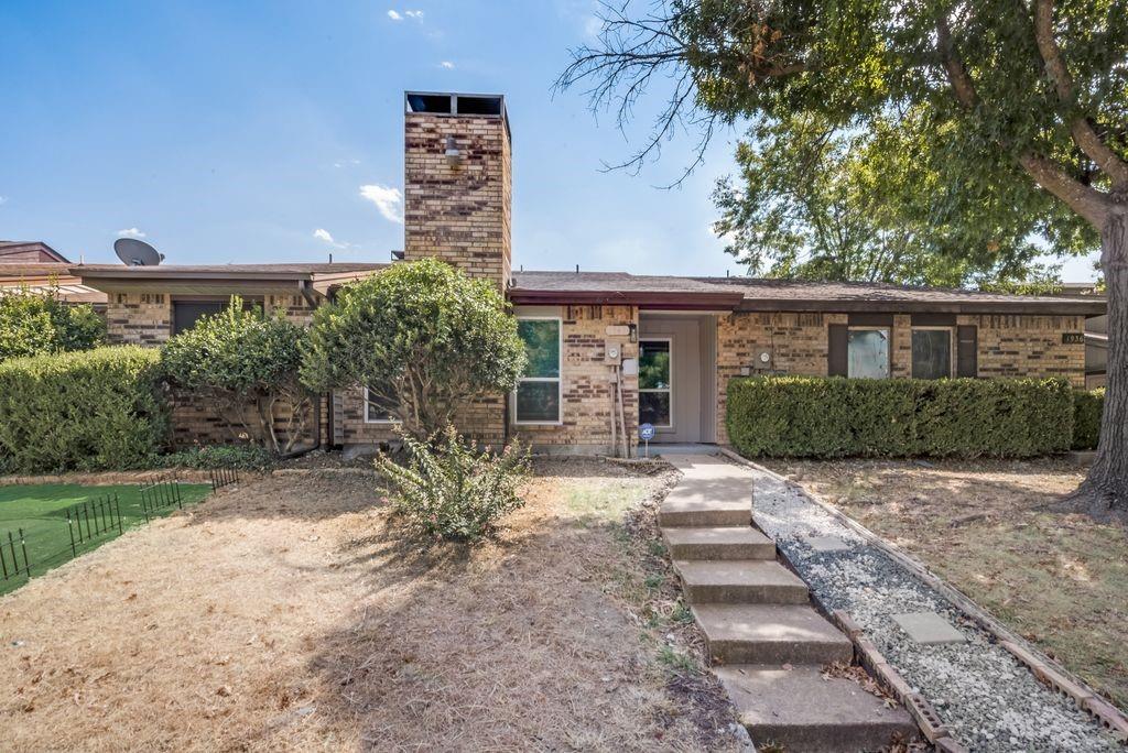 1940 Abshire Lane Dallas, TX 75228 - Photo 1 of 1 a front view of a house with garden