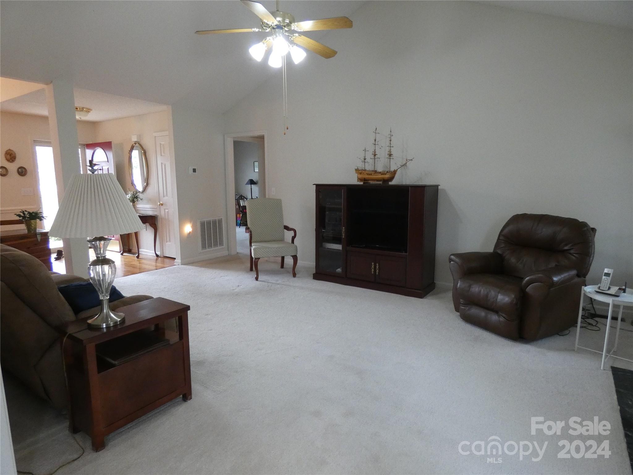 3803 River Road Hickory, NC 28602 - Photo 12 of 24 a living room with furniture and a flat screen tv