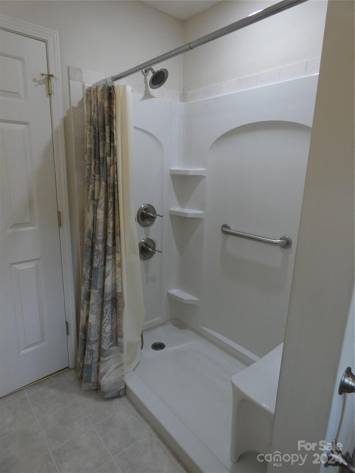 3803 River Road Hickory, NC 28602 - Photo 17 of 24 a bathroom with a shower and a tub