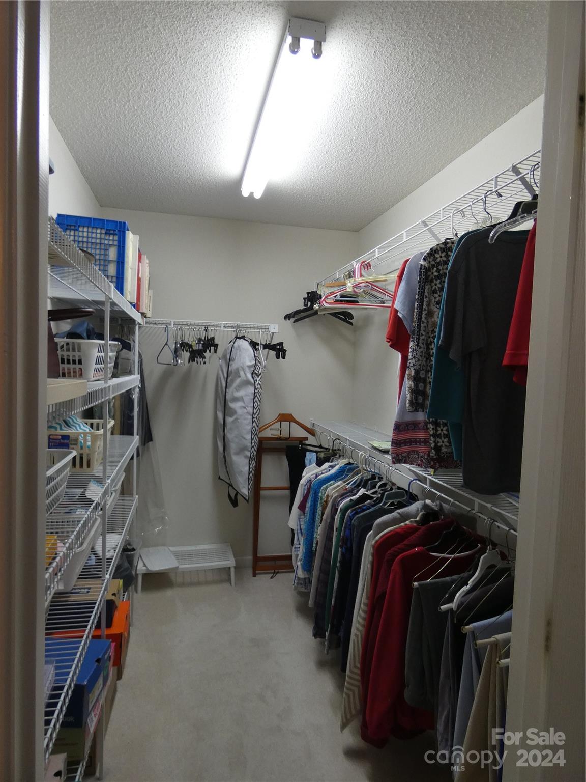 3803 River Road Hickory, NC 28602 - Photo 18 of 24 a view of walk in closet with clothes and shoes