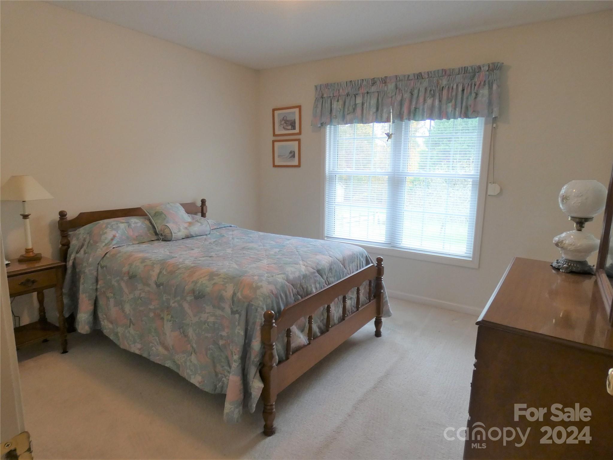 3803 River Road Hickory, NC 28602 - Photo 19 of 24 a spacious bedroom with a bed and window