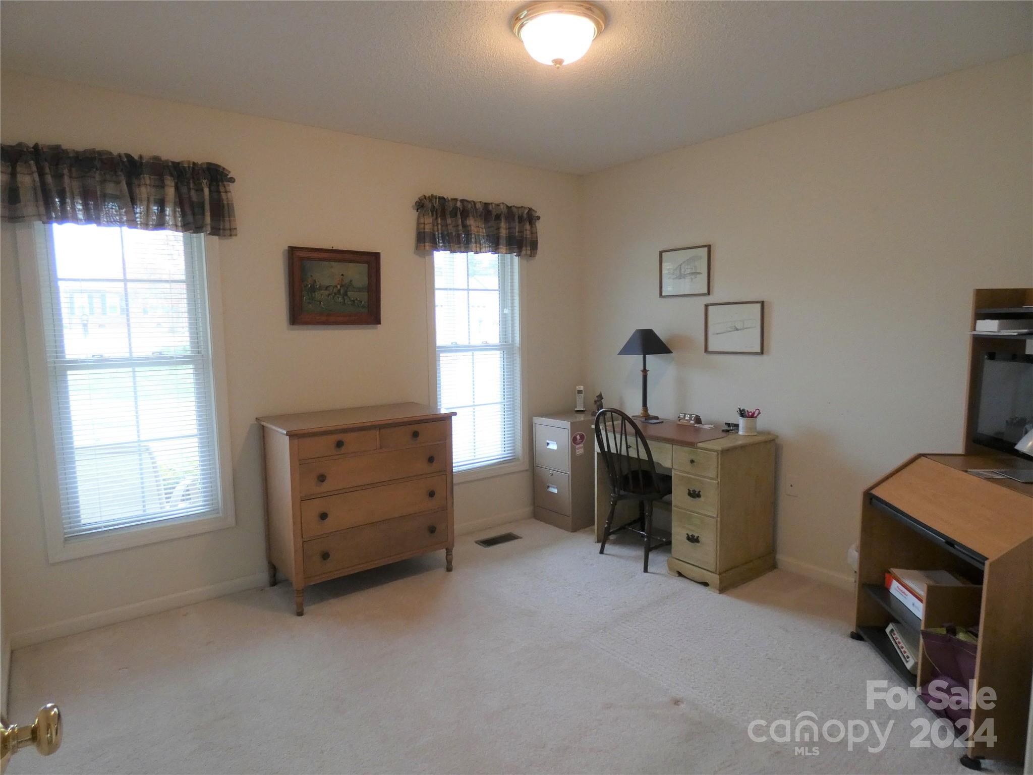 3803 River Road Hickory, NC 28602 - Photo 21 of 24 a bedroom with a bed and a window