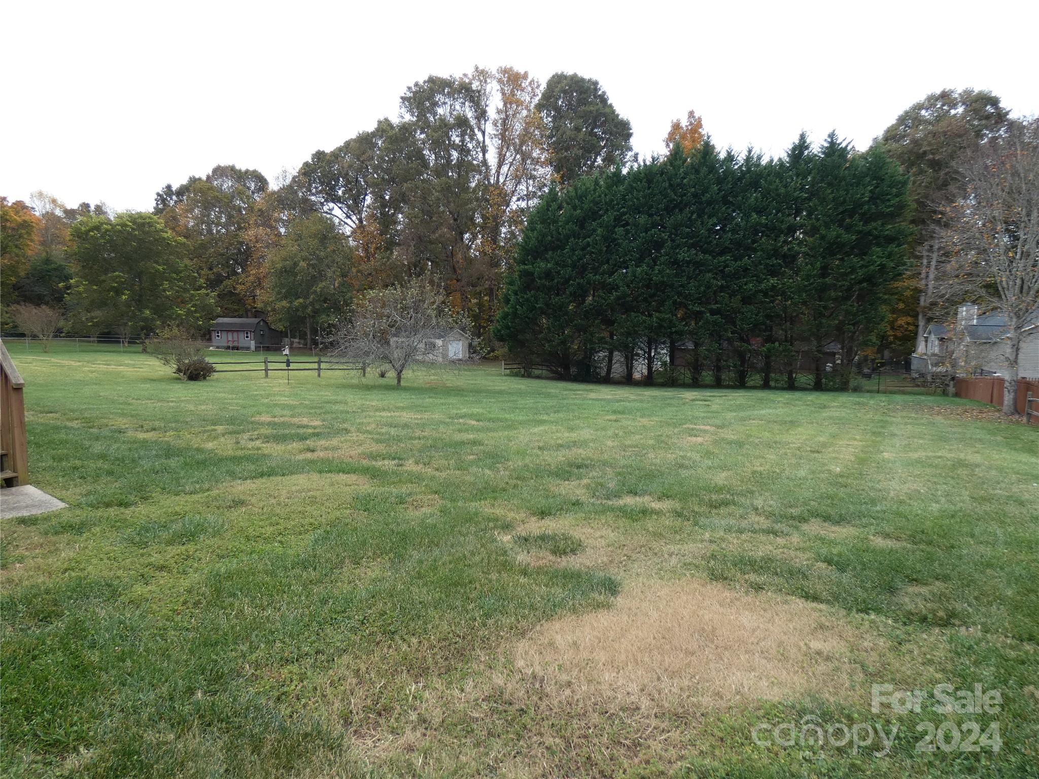 3803 River Road Hickory, NC 28602 - Photo 23 of 24 a grassy field with trees in the background