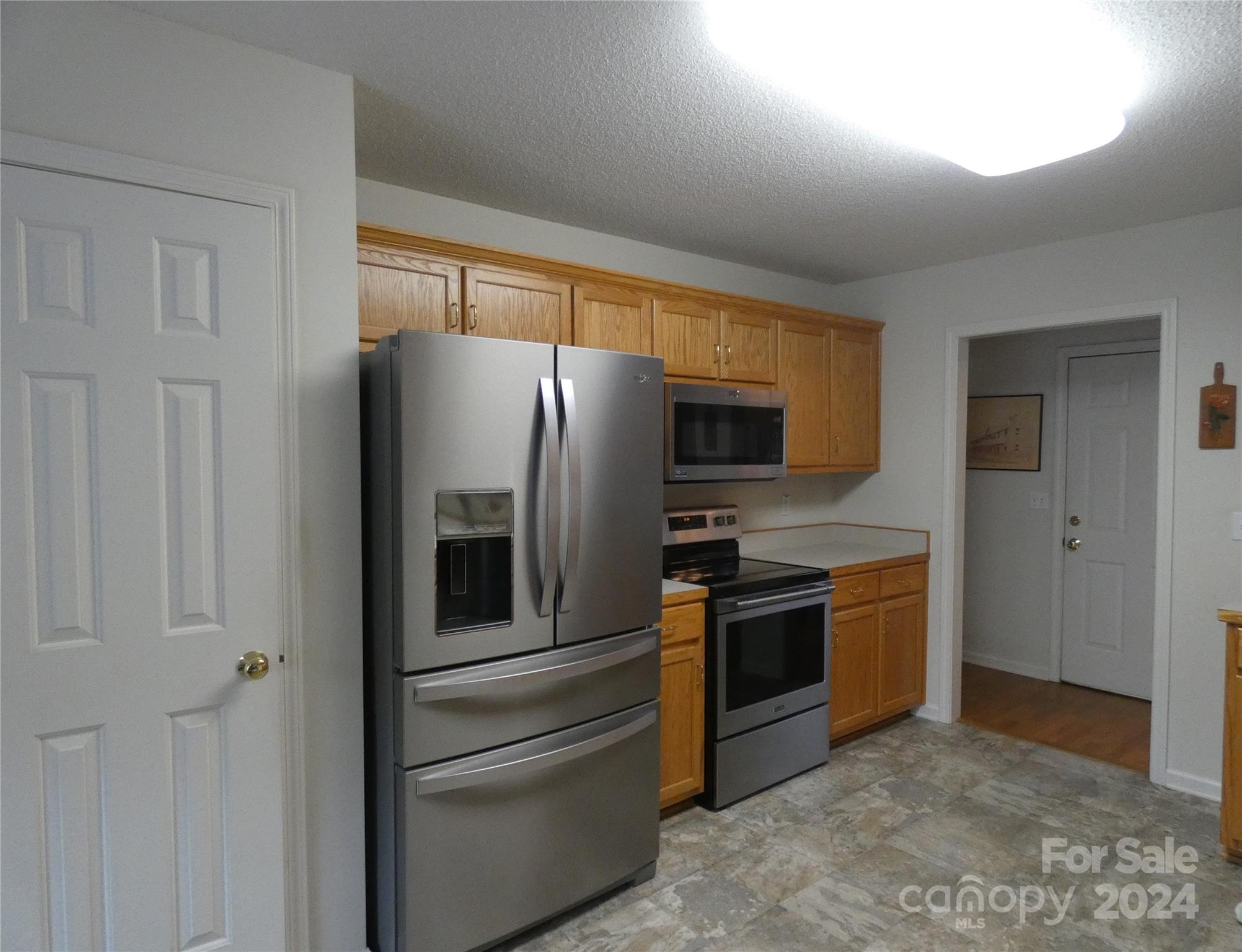3803 River Road Hickory, NC 28602 - Photo 5 of 24 a kitchen with stainless steel appliances granite countertop a refrigerator and a stove