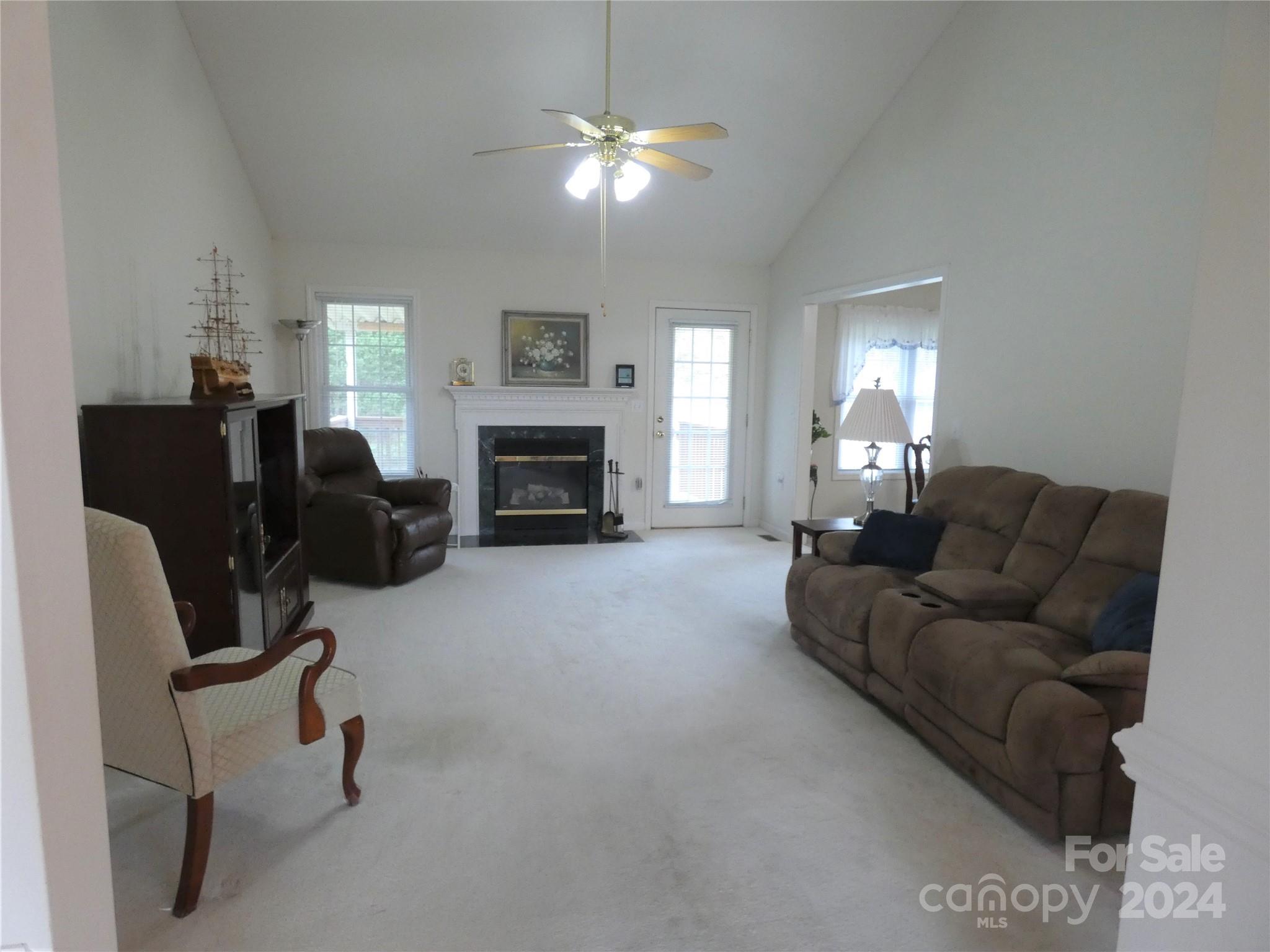 3803 River Road Hickory, NC 28602 - Photo 9 of 24 a living room with furniture and a fireplace