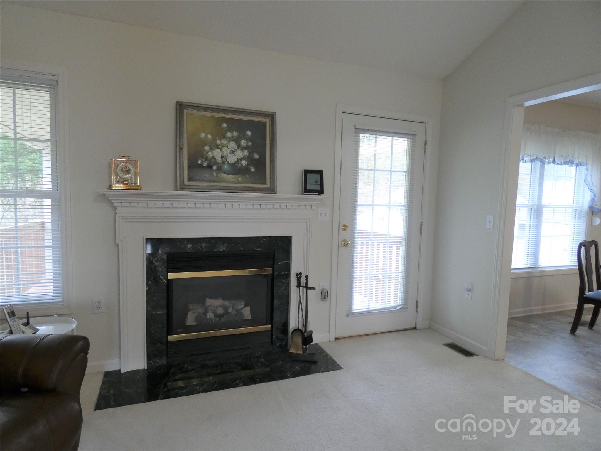 3803 River Road Hickory, NC 28602 - Photo 10 of 24 a living room with furniture and a fireplace