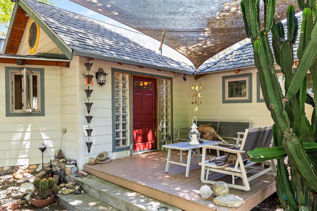 8416 Wheeler Canyon Road Santa Paula, CA 93060 - Photo 8 of 48 a patio with table and chairs and potted plants