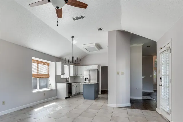 a open kitchen with a sink and dishwasher a refrigerator with wooden floor