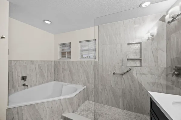 a bathroom with a bathtub and a toilet