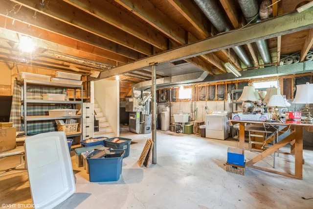 a living room with lots of furniture and clutter