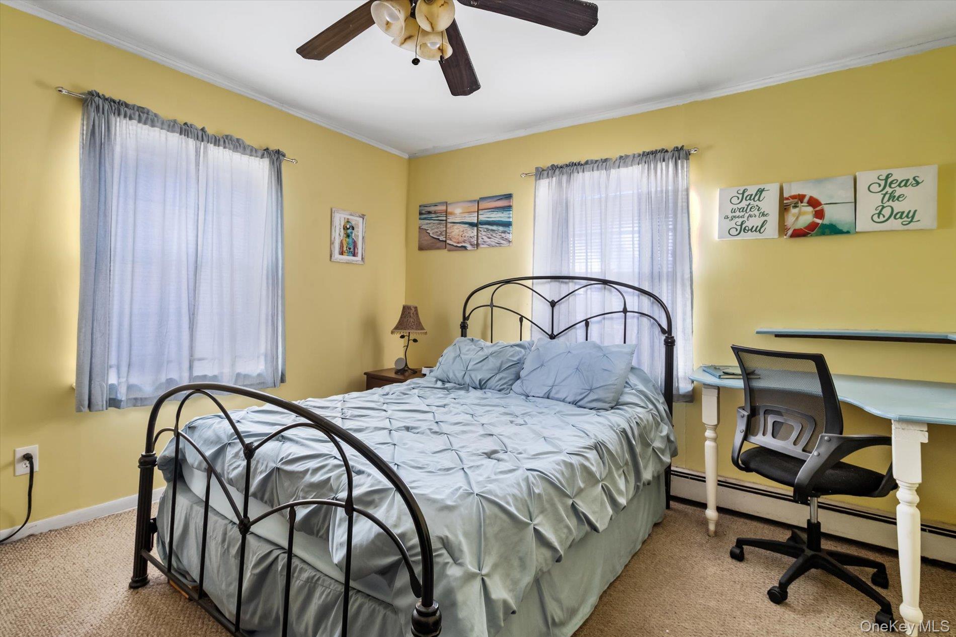 8 July Walk Long Beach, NY 11561 - Photo 11 of 14 a bedroom with a bed and a dresser