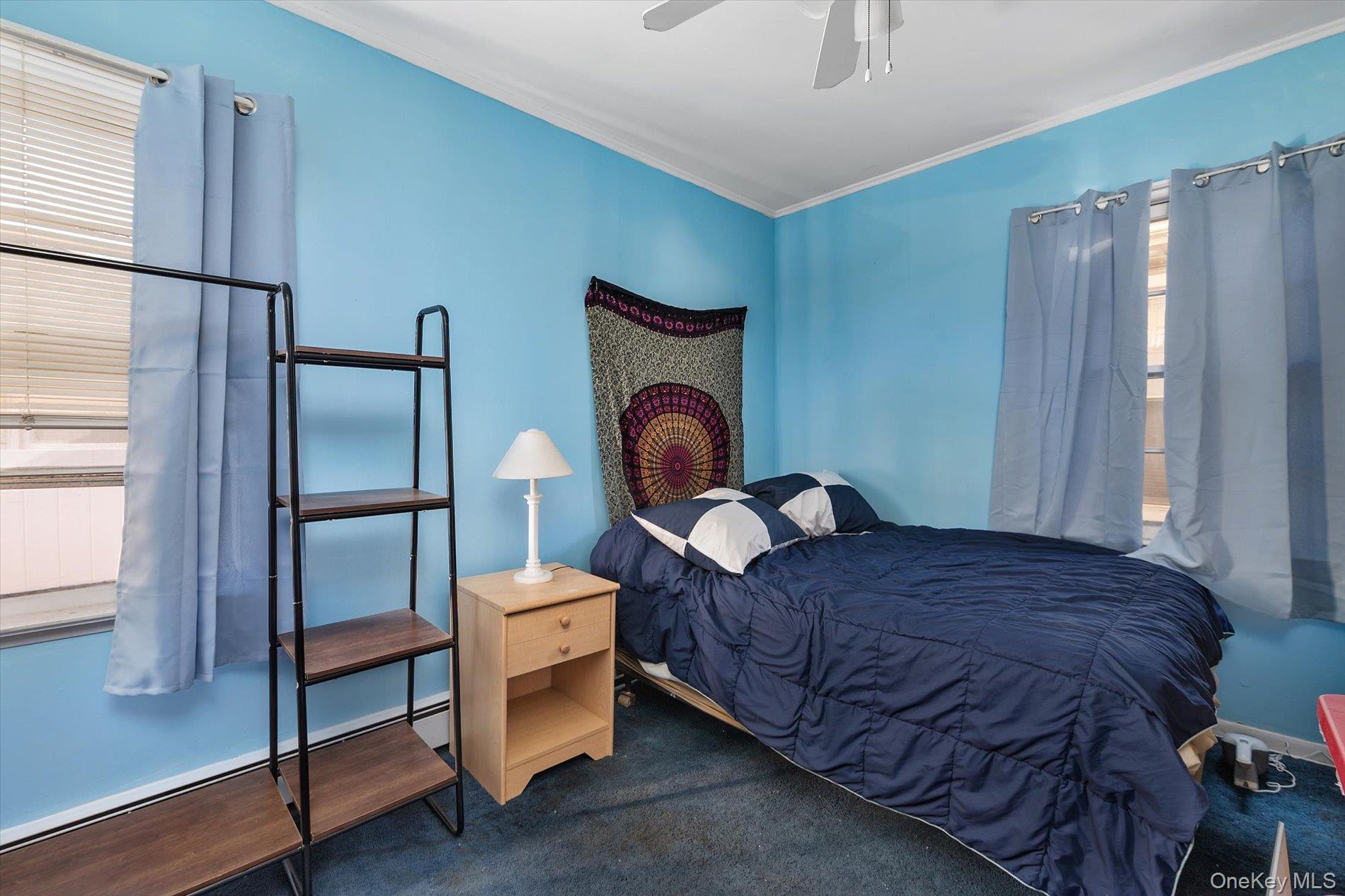 8 July Walk Long Beach, NY 11561 - Photo 12 of 14 a bedroom with a bed and a window