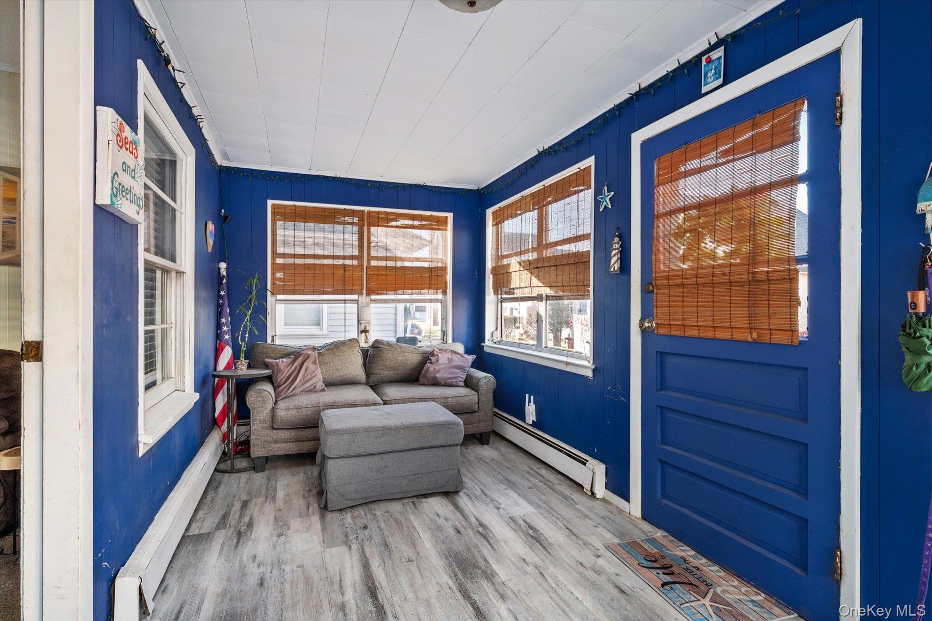 8 July Walk Long Beach, NY 11561 - Photo 4 of 14 a living room with furniture and a large window