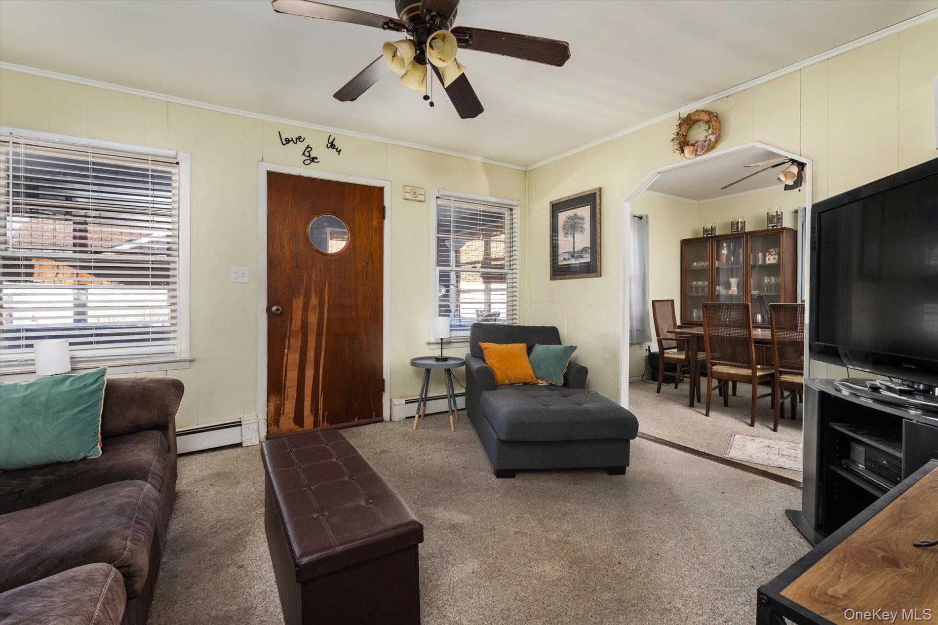 8 July Walk Long Beach, NY 11561 - Photo 7 of 14 a living room with furniture and a flat screen tv