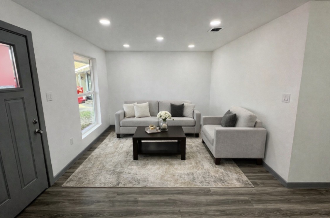 8803 Cottage Gate Lane Houston, TX 77088 - Photo 18 of 32 a living room with furniture and a window
