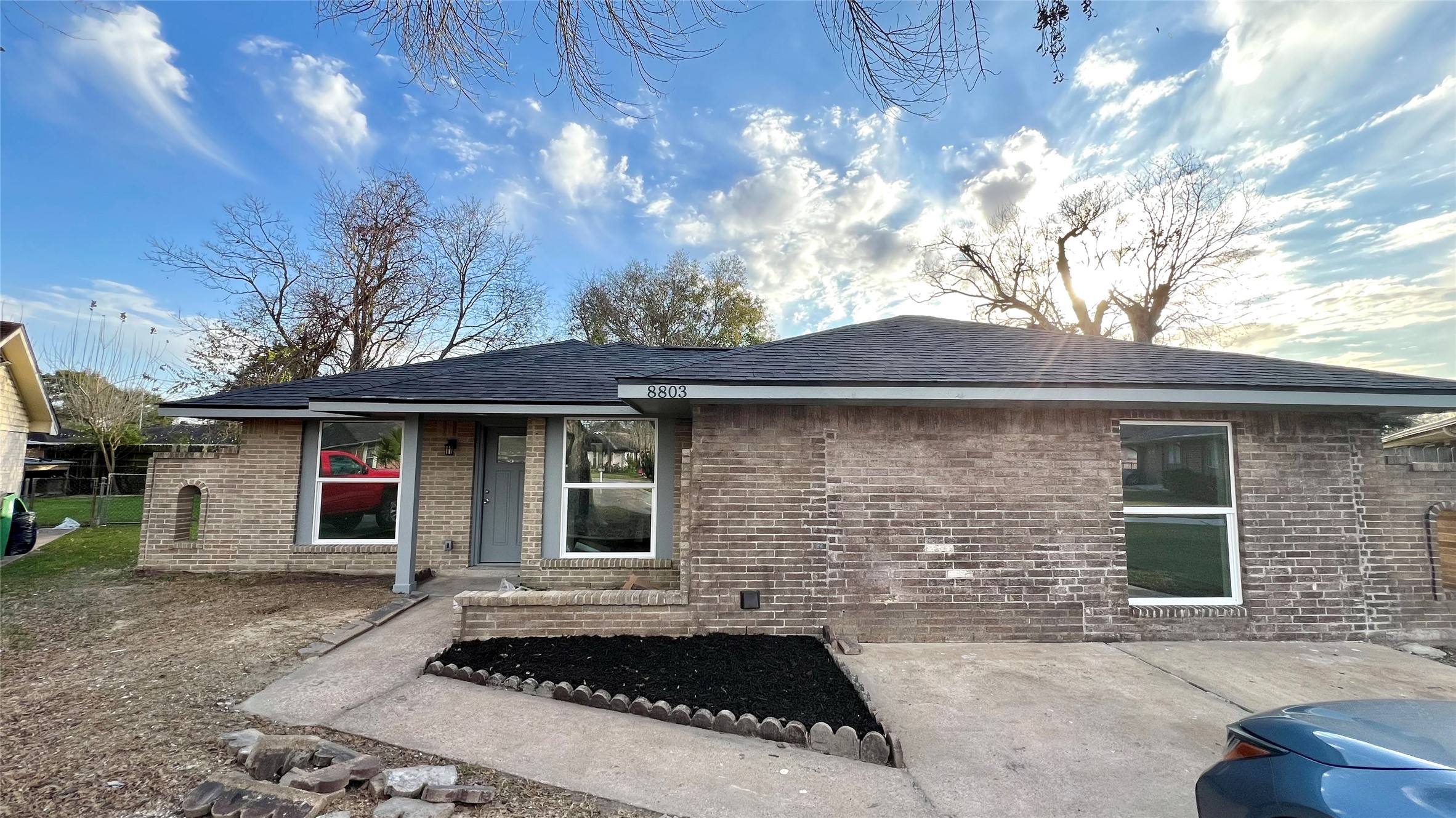 8803 Cottage Gate Lane Houston, TX 77088 - Photo 2 of 32 a front view of a house with a yard