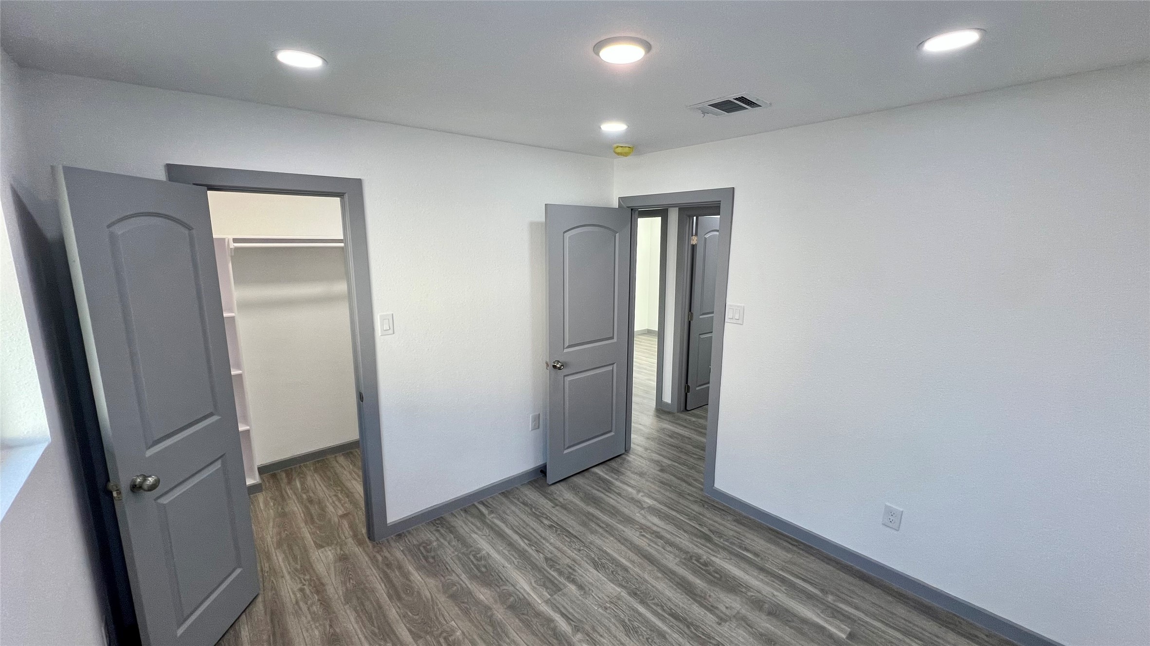 8803 Cottage Gate Lane Houston, TX 77088 - Photo 25 of 32 a view of hallway with wooden floor