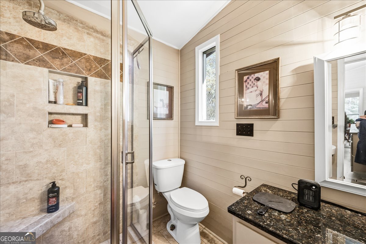 606 Morgan Road Juliette, GA 31046 - Photo 14 of 35 a bathroom with a toilet a sink and a shower