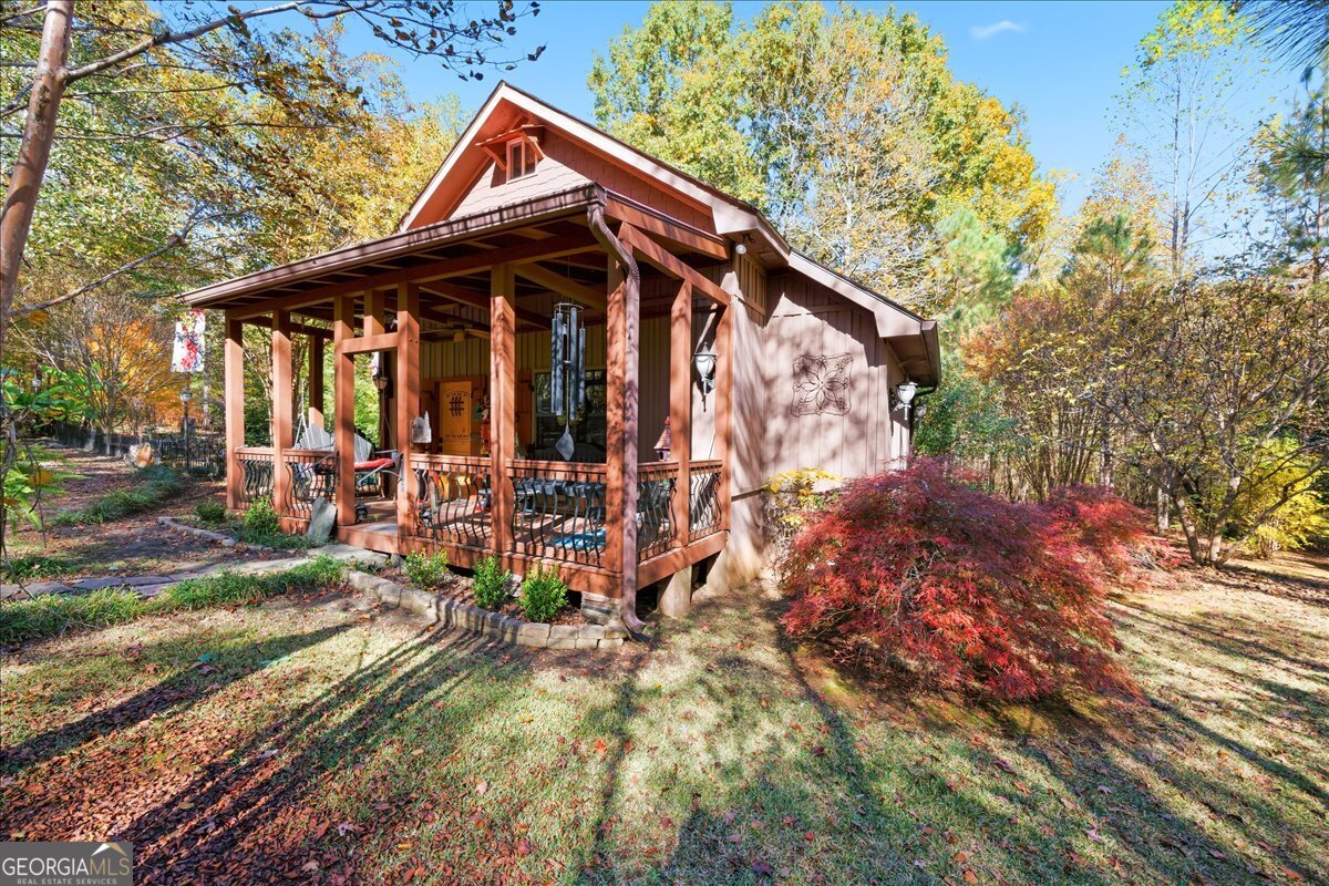 606 Morgan Road Juliette, GA 31046 - Photo 2 of 35 a view of a house with yard and sitting area