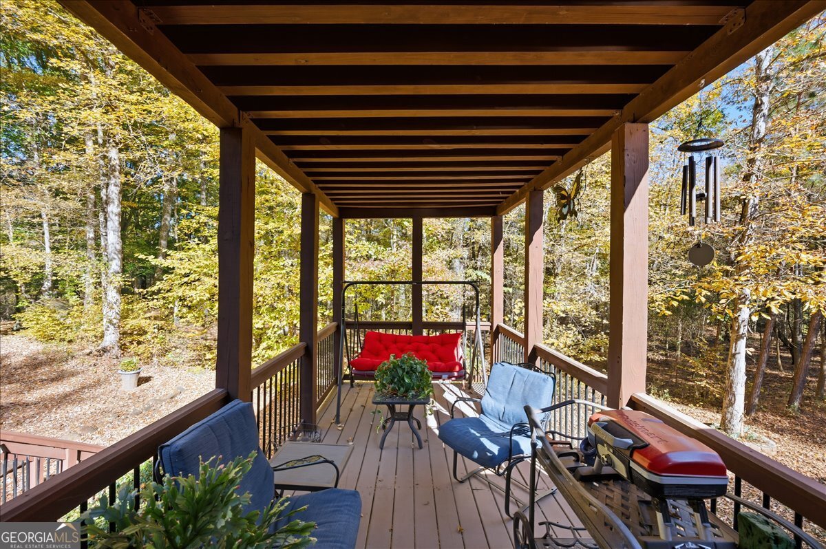 606 Morgan Road Juliette, GA 31046 - Photo 22 of 35 a view of balcony with chairs and wooden floor