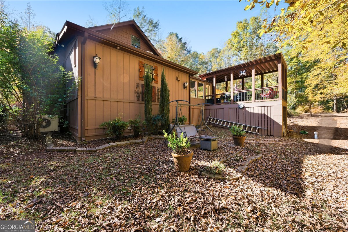 606 Morgan Road Juliette, GA 31046 - Photo 24 of 35 a front view of a house with garden