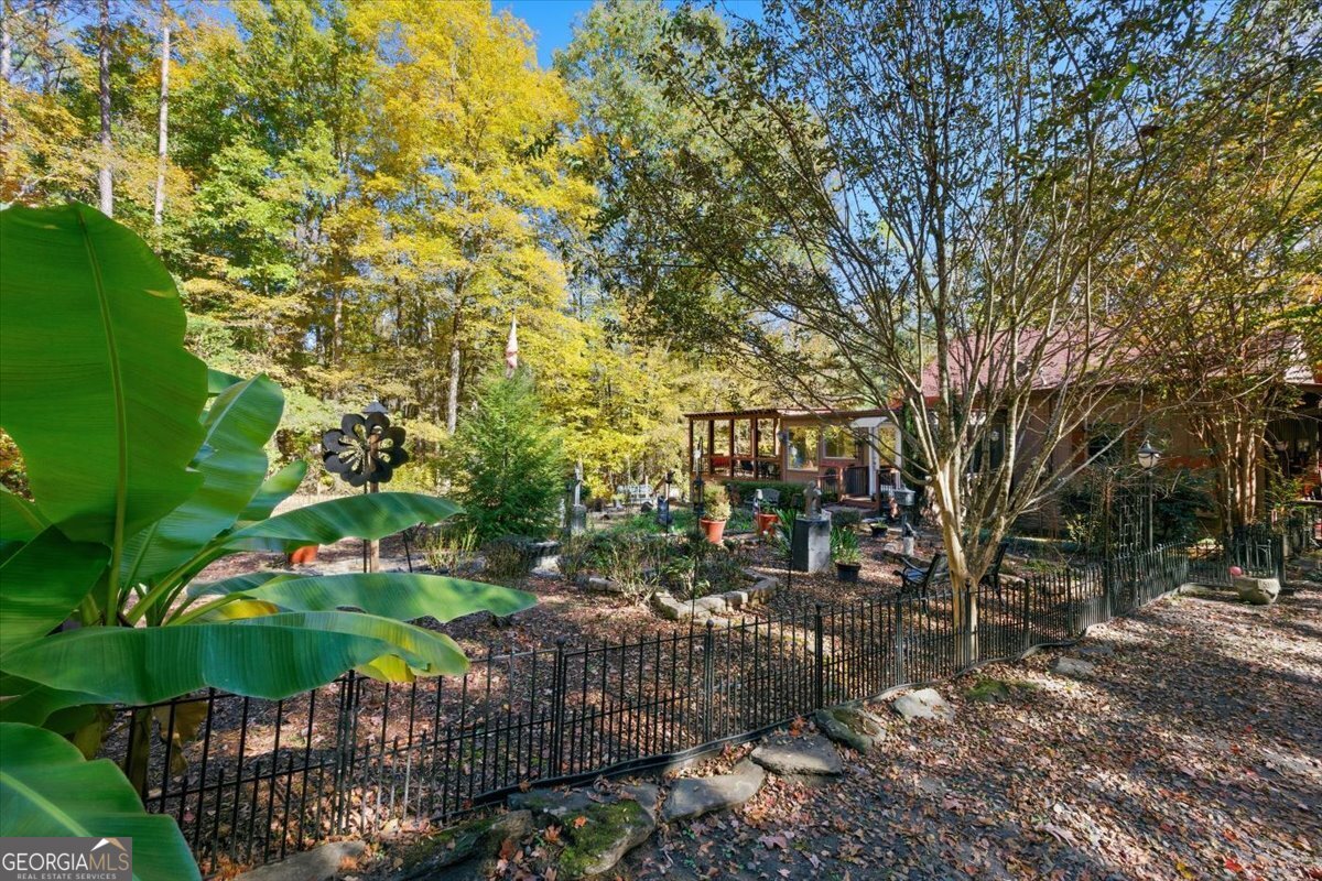 606 Morgan Road Juliette, GA 31046 - Photo 25 of 35 a backyard of a house with lots of green space