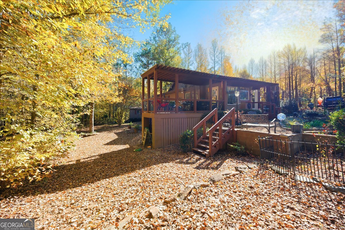 606 Morgan Road Juliette, GA 31046 - Photo 27 of 35 a wooden bench sitting in front of a house