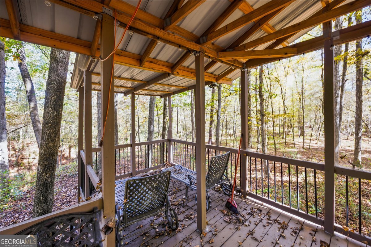 606 Morgan Road Juliette, GA 31046 - Photo 32 of 35 a view of a porch with furniture and wooden deck