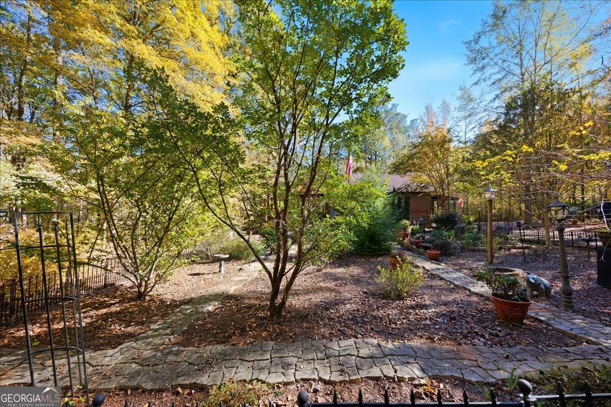 606 Morgan Road Juliette, GA 31046 - Photo 35 of 35 a backyard of a house with lots of green space