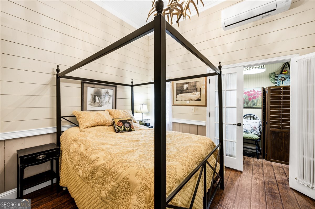 606 Morgan Road Juliette, GA 31046 - Photo 8 of 35 a bedroom with a bed and wooden floor