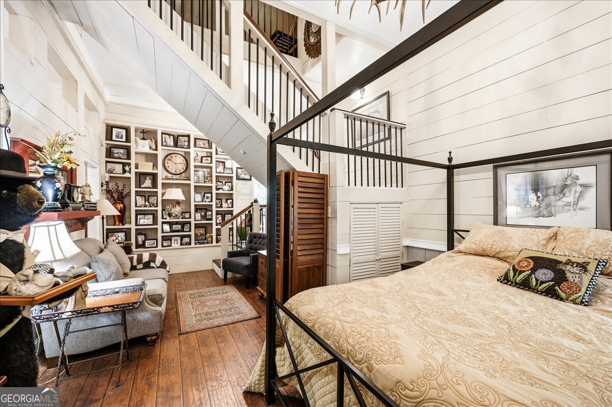 606 Morgan Road Juliette, GA 31046 - Photo 9 of 35 a bedroom with furniture and a large window