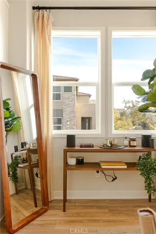 a living room with a table chairs and a table