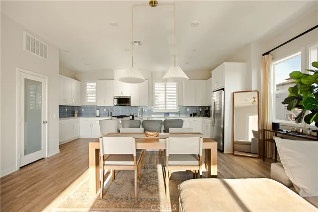 a view of a dining room with furniture and a rug
