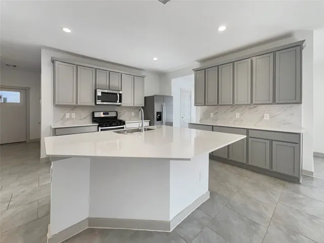 a view of an empty room and a window